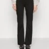 DRYKORN Far - Flared Jeans - Black -Winkel Voor Damesmode 9322550fd59d4d9dbc45941e46f44944