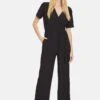 CARTOON Mit Bindegürtel - Jumpsuit - Schwarz 2 CARTOON Mit Bindegürtel - Jumpsuit - Schwarz -Winkel Voor Damesmode c4f10d845479456cbcd8cb8d211330a9